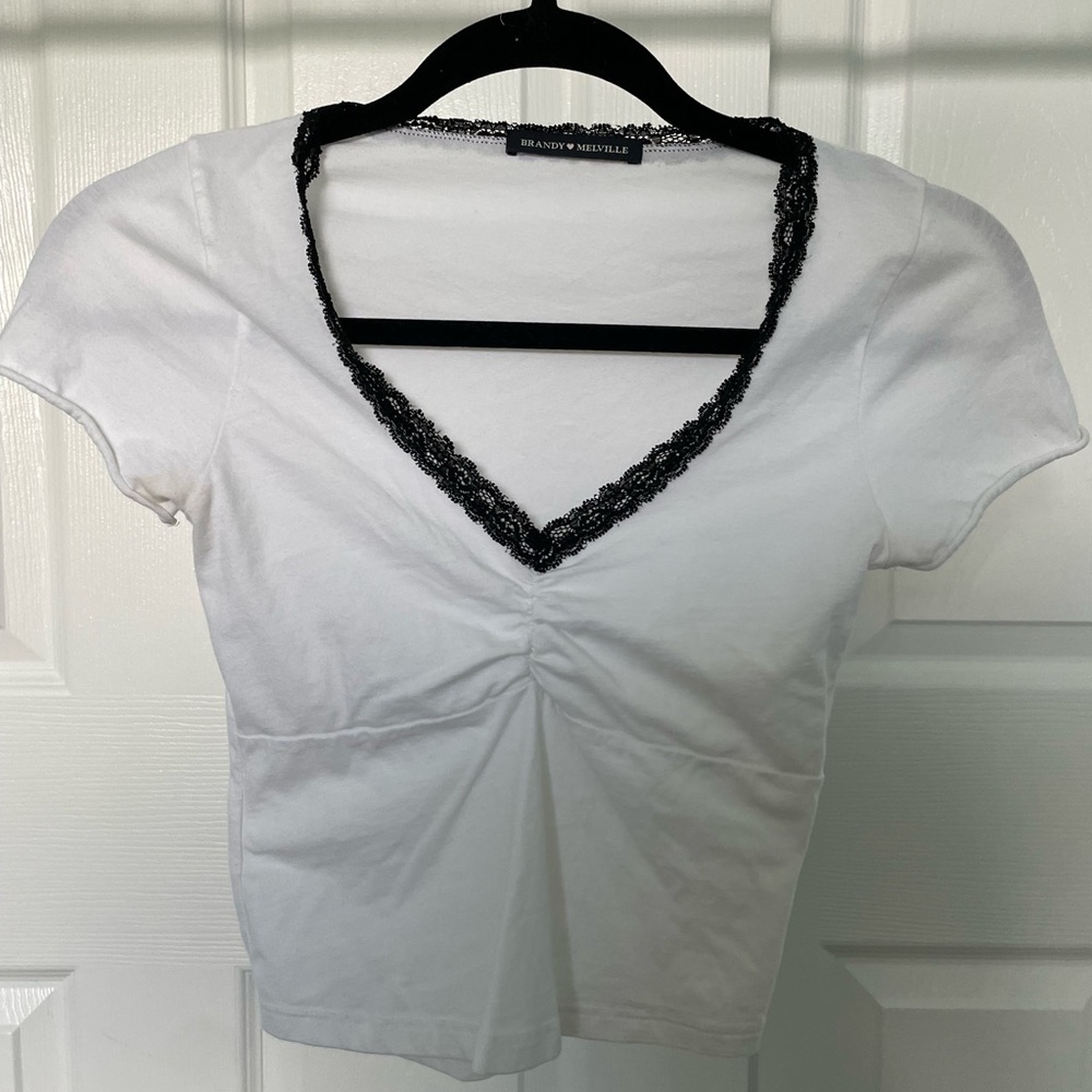 White brandy melville shirt with black lace detail
